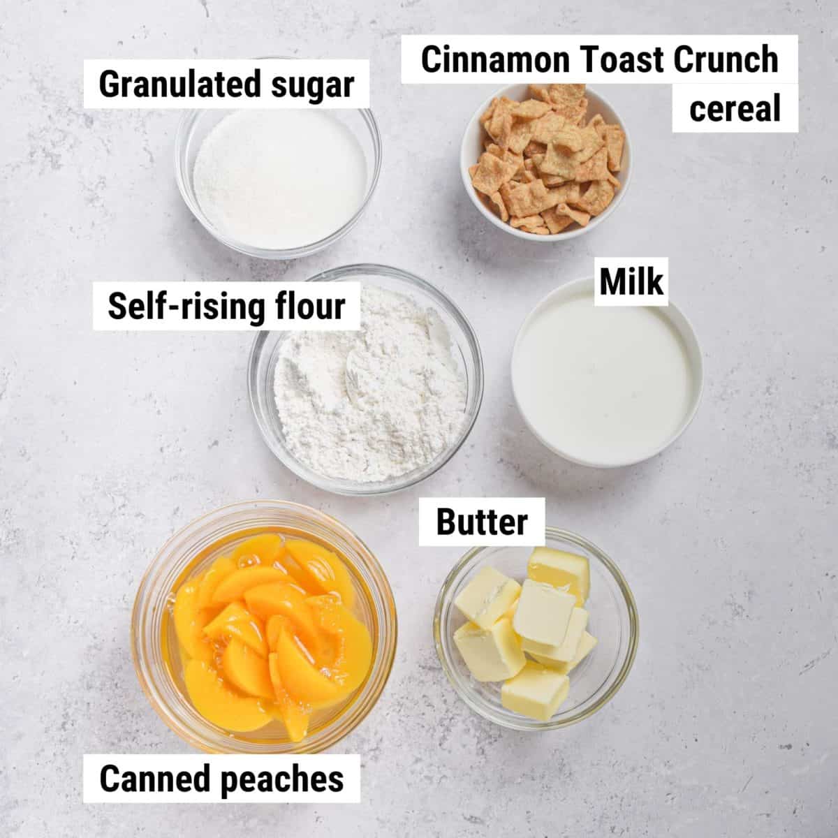 The recipe ingredients used to make cinnamon toast crunch peach cobbler laid out on a table.