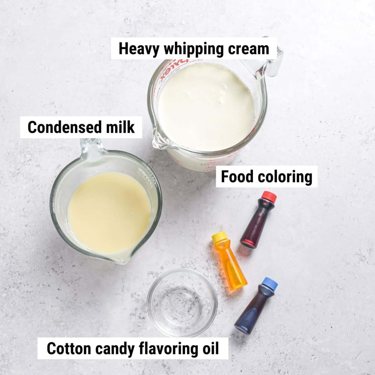 The recipe ingredients used to make cotton candy ice cream laid out on a table.