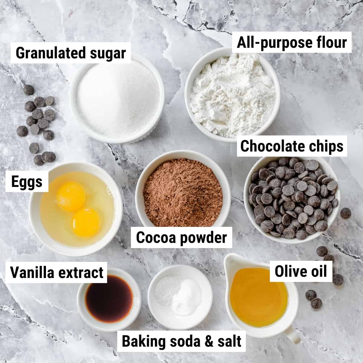 The ingredients needed to make dairy free brownies spread out on a table.