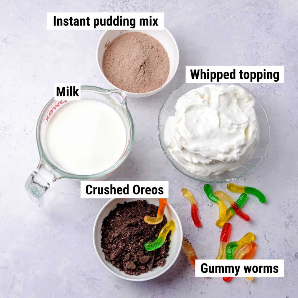 The ingredients used to make dessert dirt cups laid out on a table.
