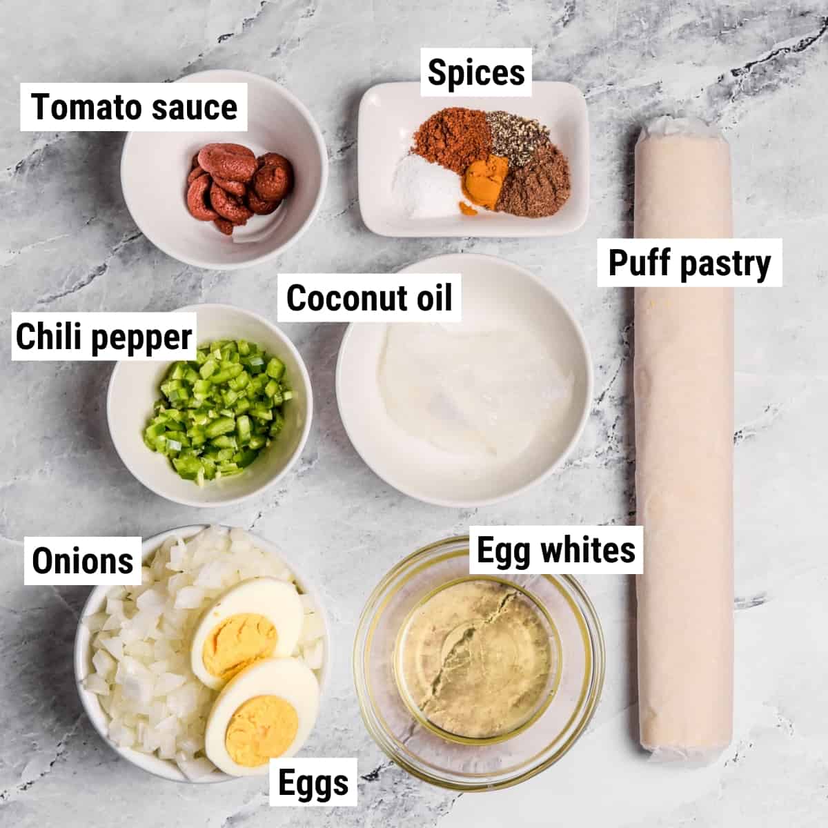 The ingredients used to make egg puffs spread out on a table.