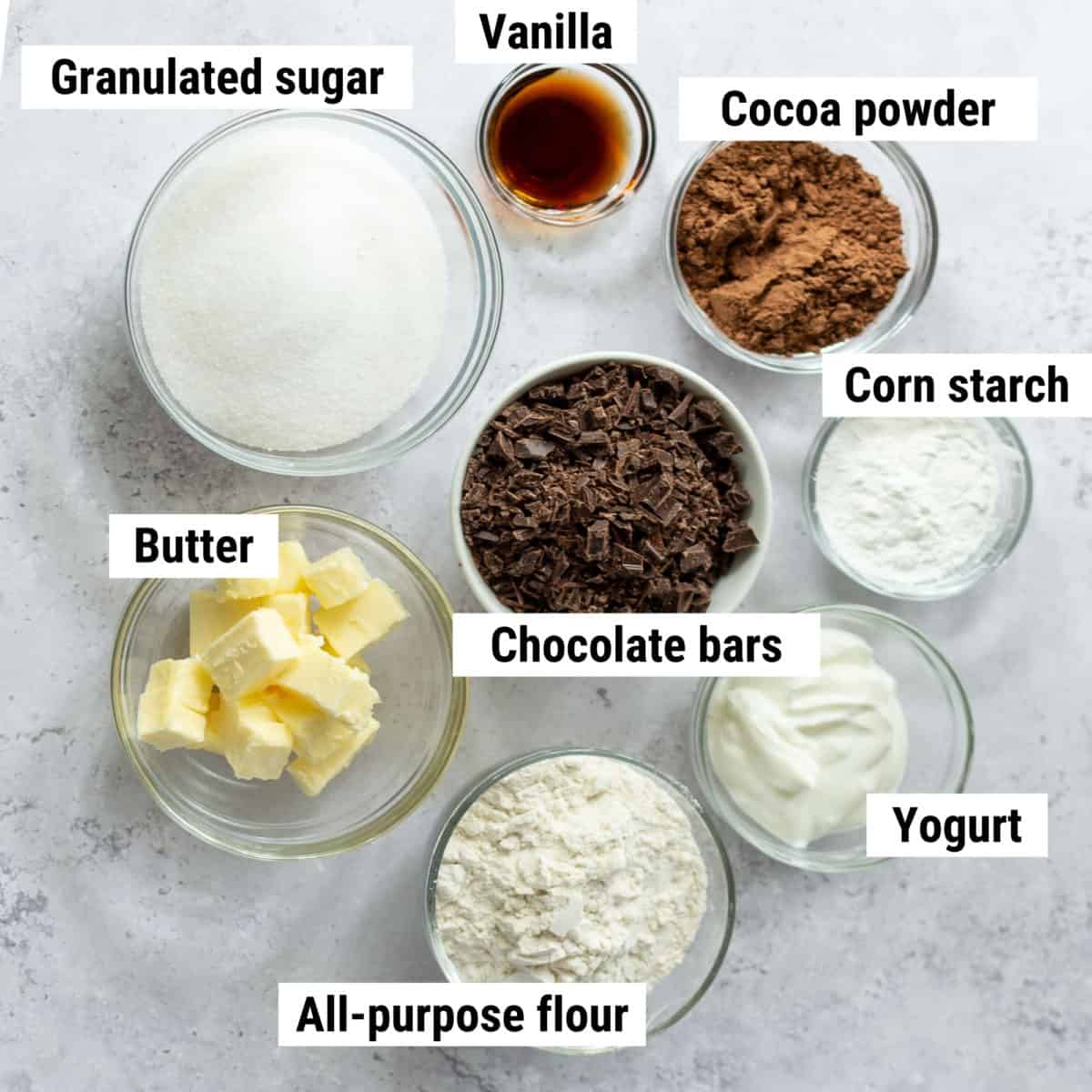 The ingredients used to make eggless brownies spread out on a table.