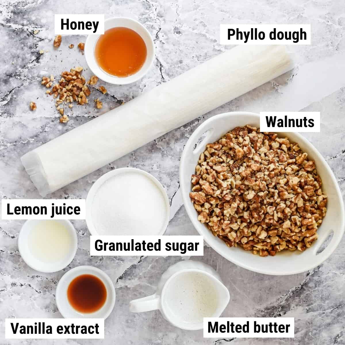 The ingredients to make Greek baklava spread out on a table.