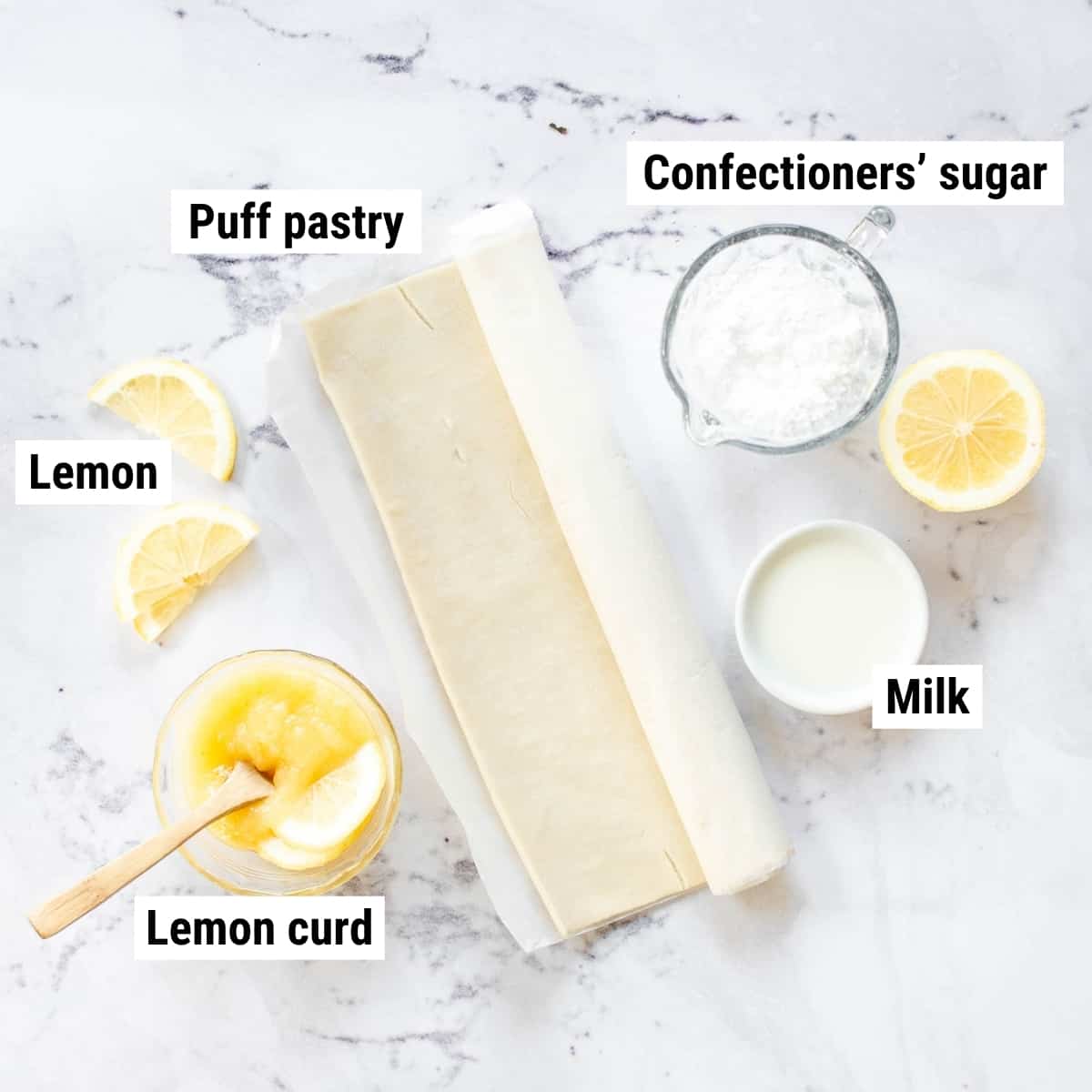 The ingredients to make lemon Danishes laid out on a table.