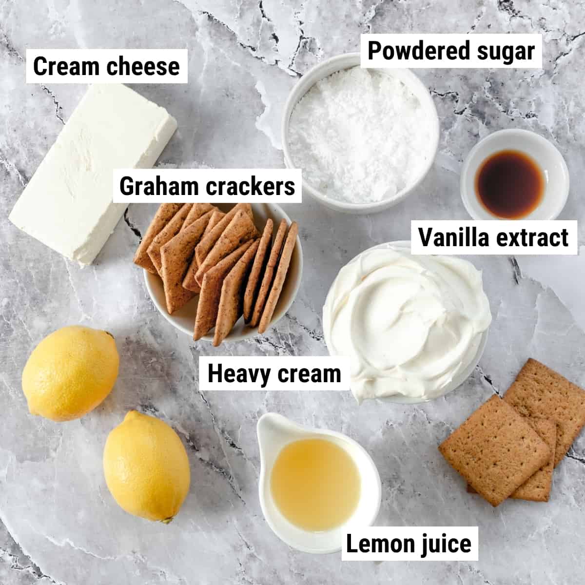 The ingredients to make a lemon icebox cake laid out on a table.