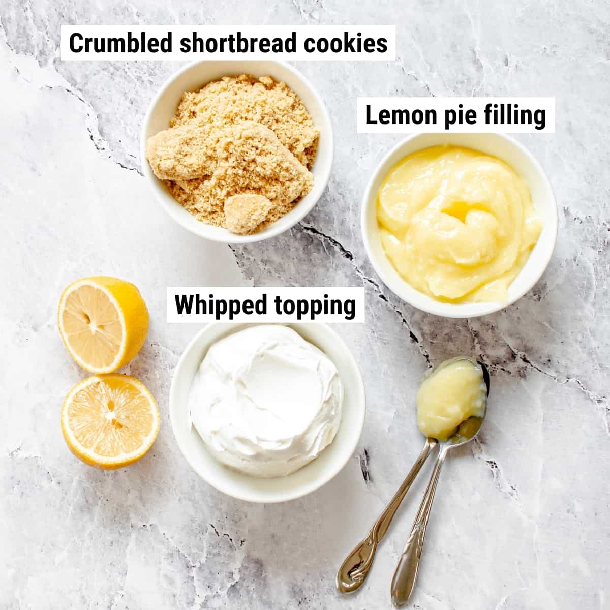 The ingredients needed to make lemon parfait spread out on a table.