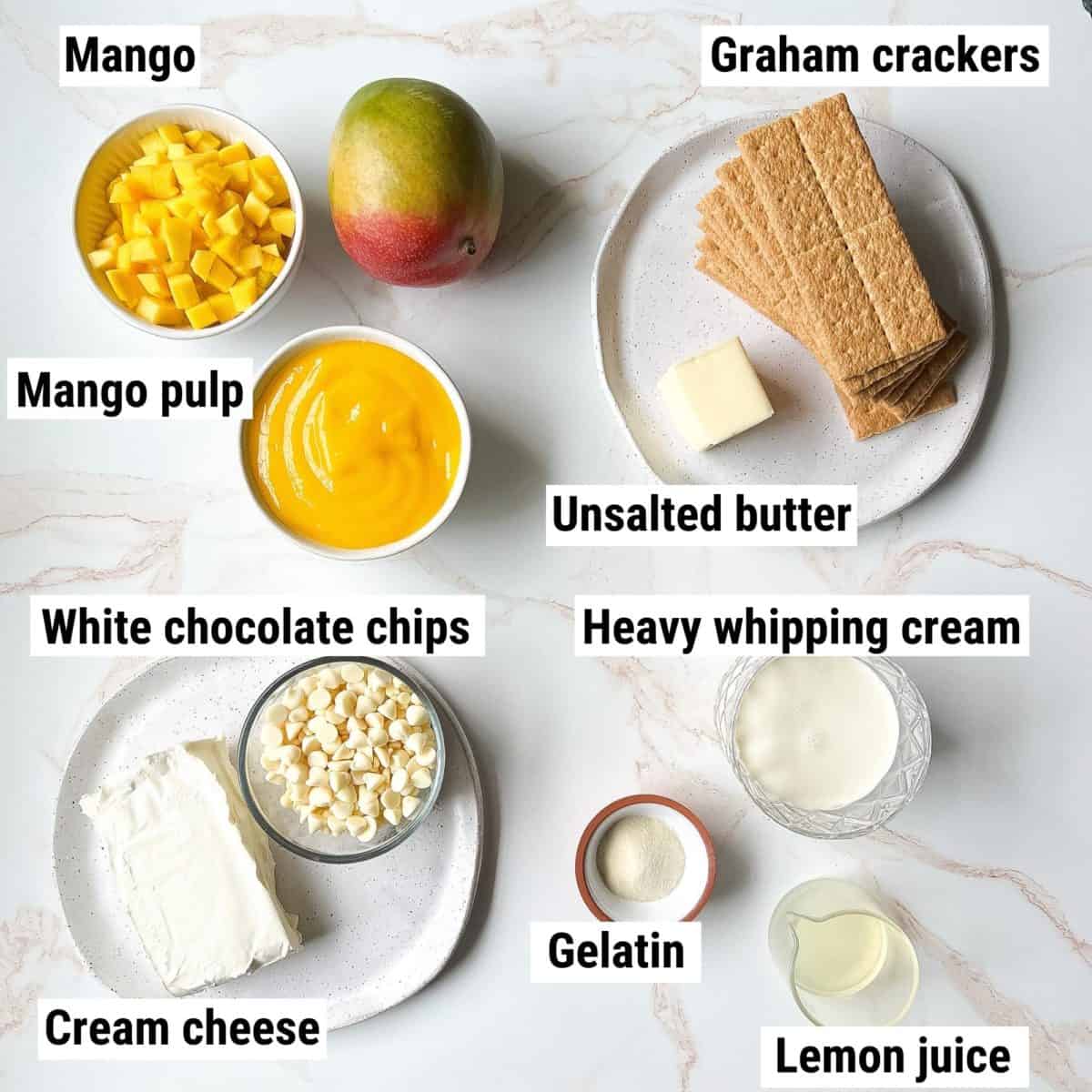 The ingredients to make mango cheesecake spread out on a table.