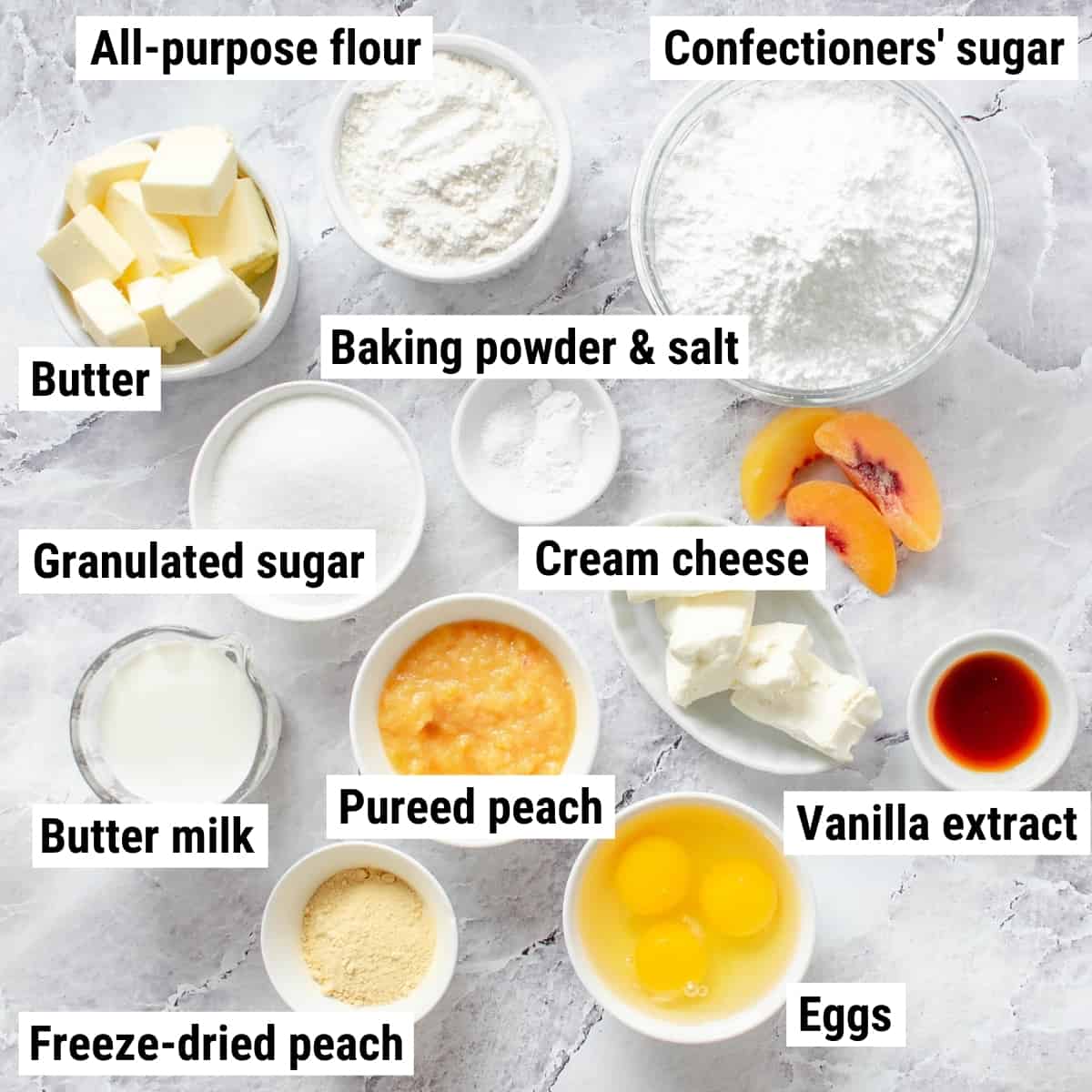 The ingredients to make peach cupcakes spread out on a table.