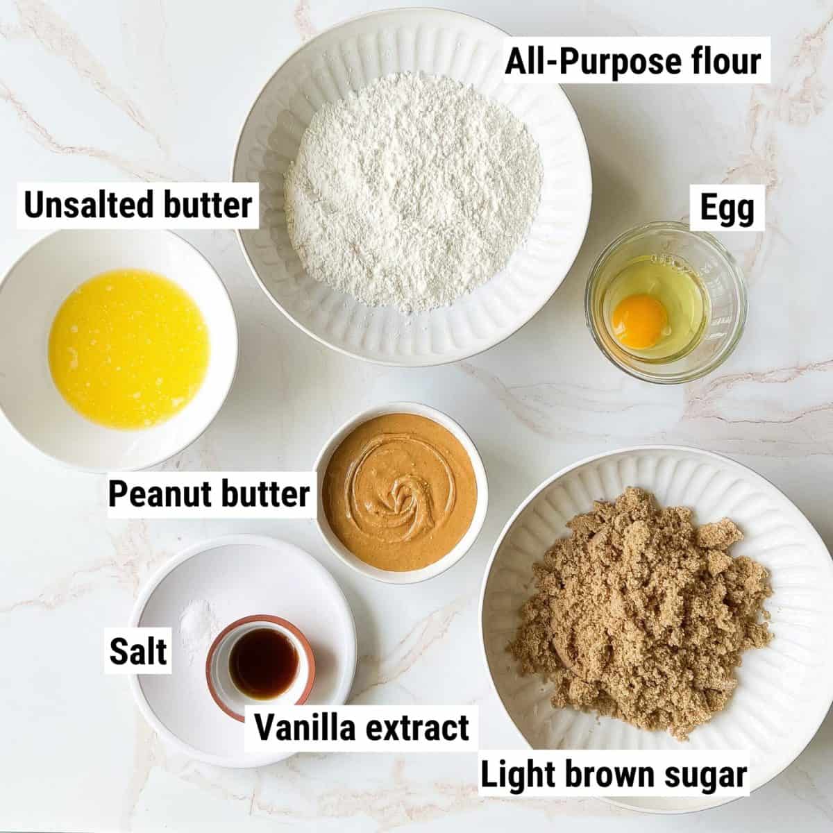 The ingredients used to make peanut butter blondies spread out on a table.