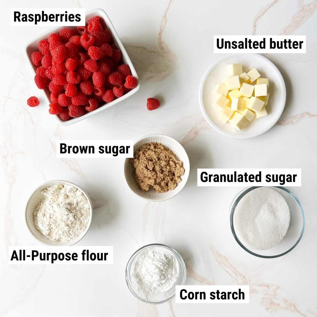 The ingredients used to make raspberry crisp spread out on a table.