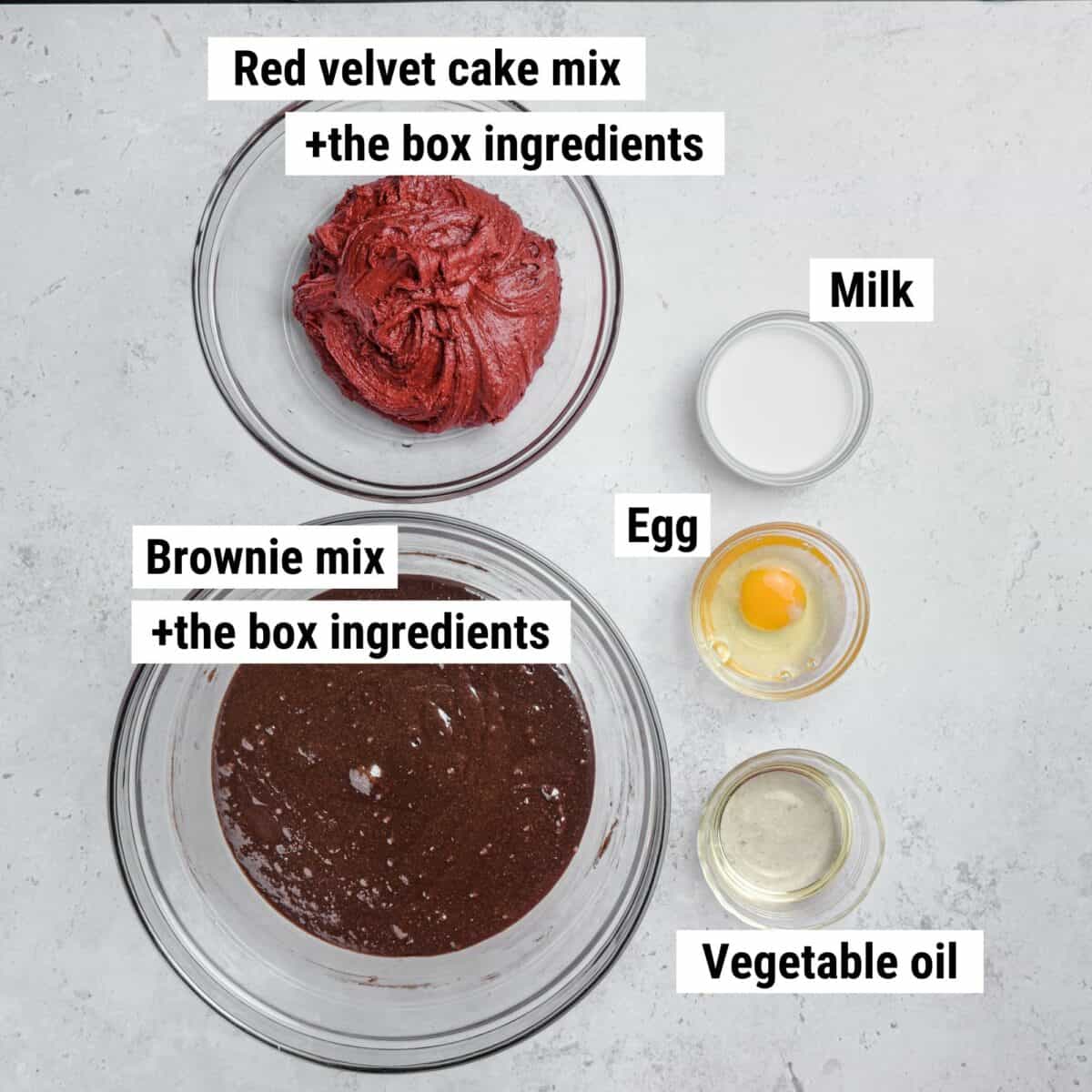 The recipe ingredients used to make red velvet brownies laid out on a table.