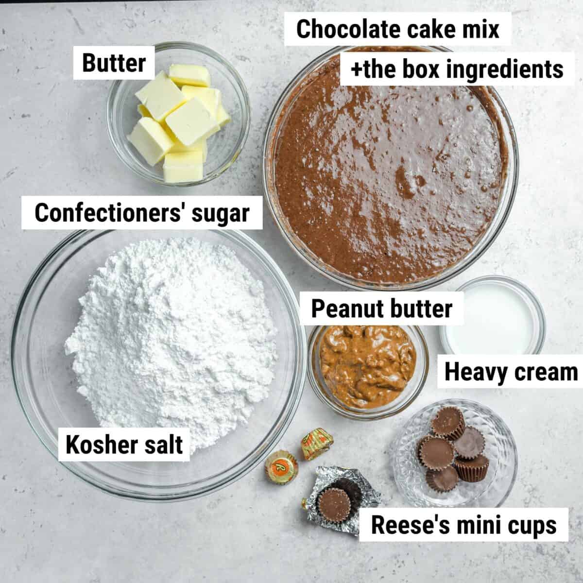 The recipe ingredients used to make Reese's cupcakes laid out on a table.