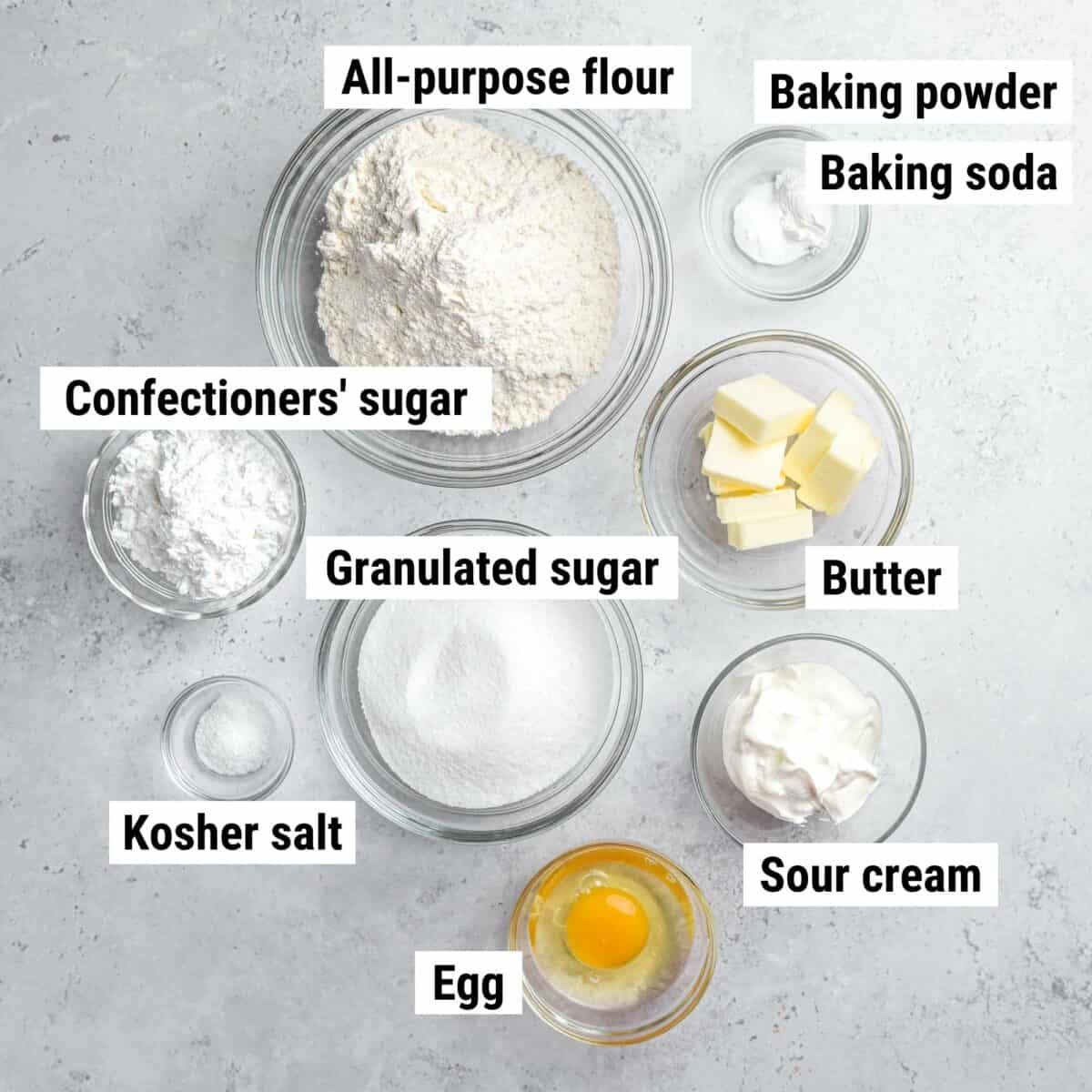 The ingredients used to make sour cream cookies laid out on a table.