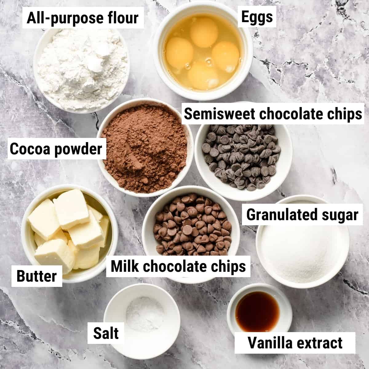 The ingredients to make triple chocolate brownies spread out on a table.