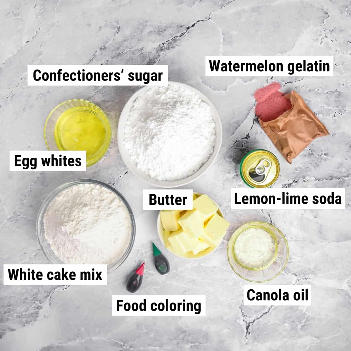 The ingredients used to make watermelon cupcakes laid out on a table.
