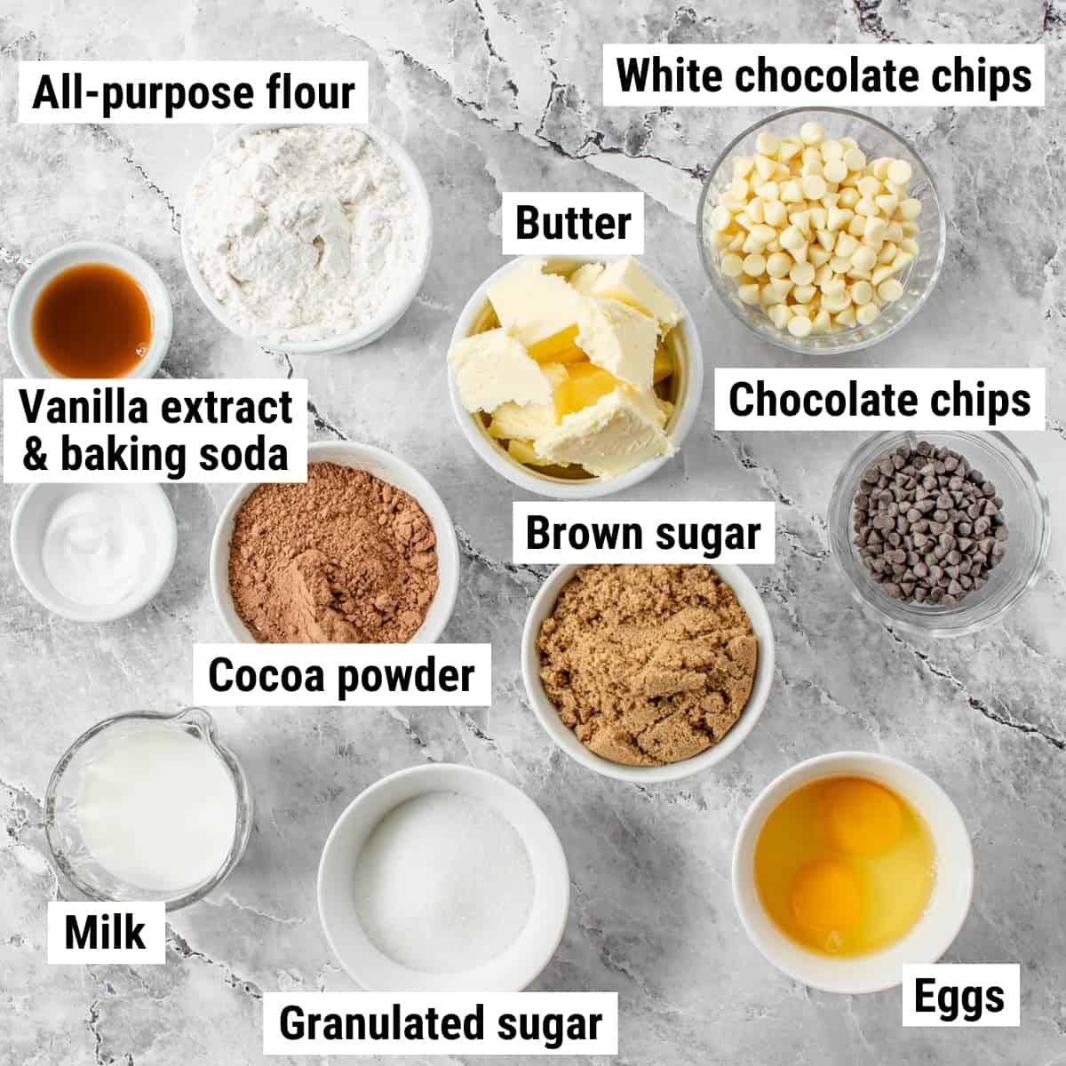 The ingredients to make white chocolate chip brownies spread out on a table.