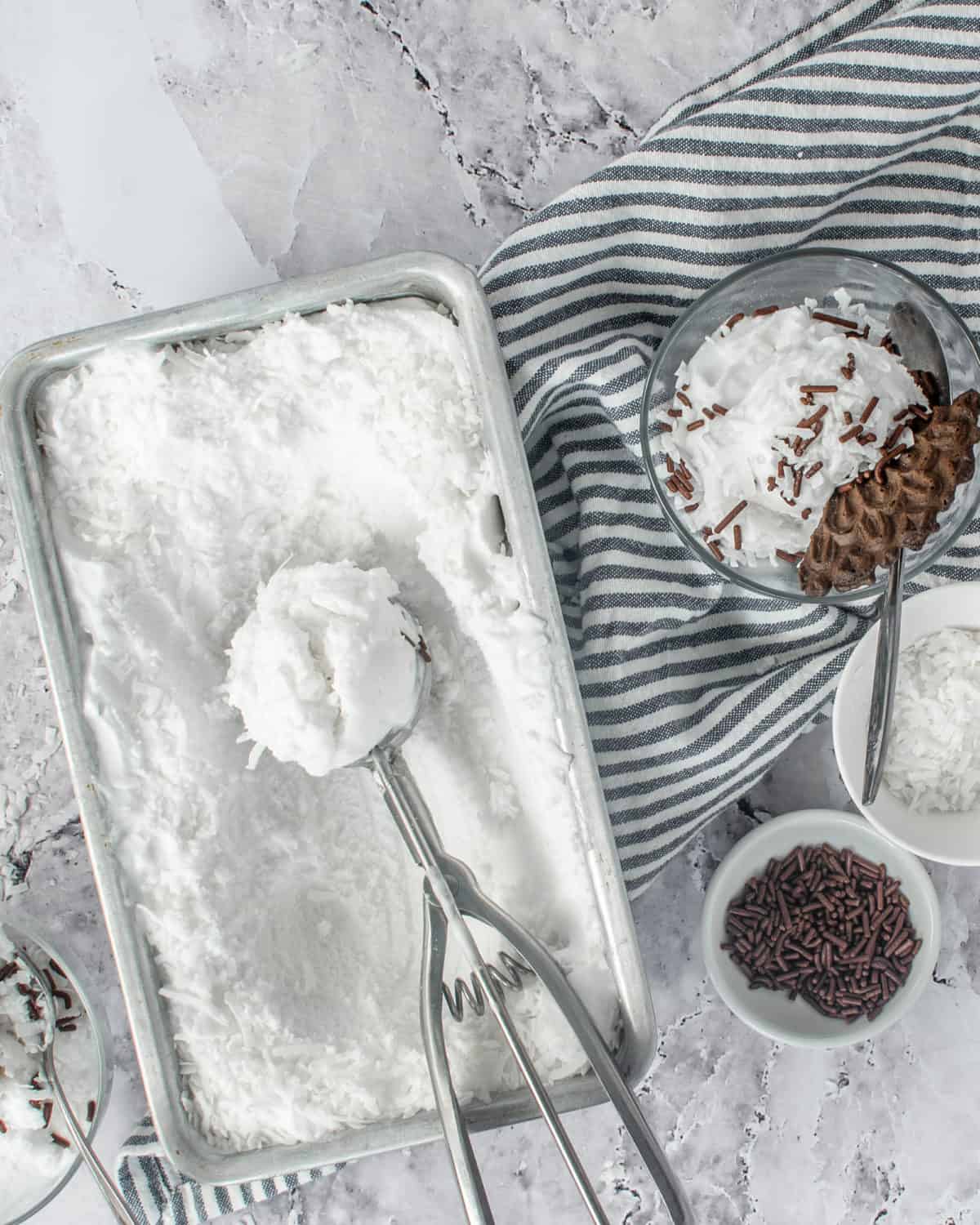 Homemade sorbet with coconut on a table.