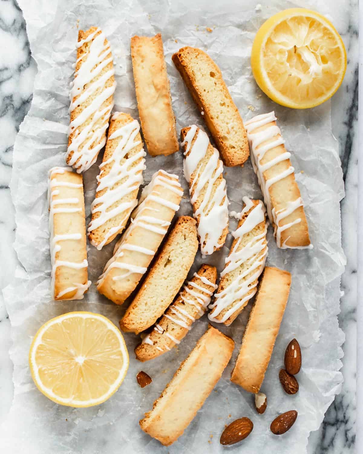 Many biscotti cookies scattered on a table.