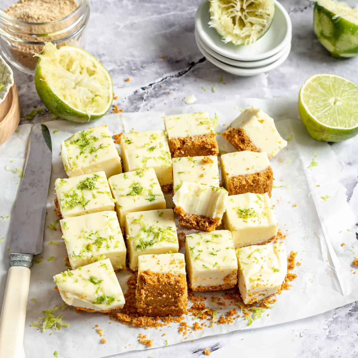 Several slices of key lime fudge laid out on a table.