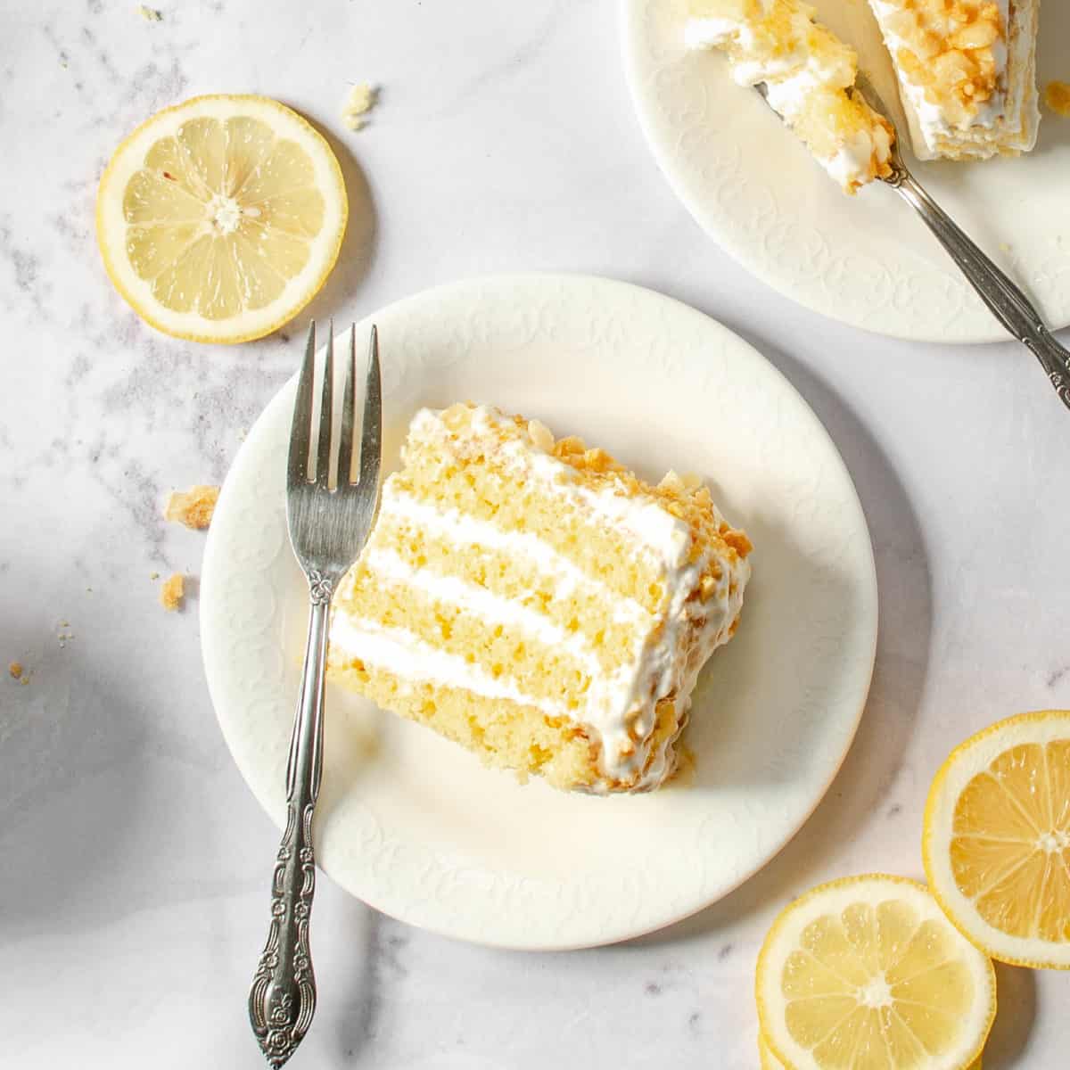 A close up shot of a piece of lemon crunch cake.