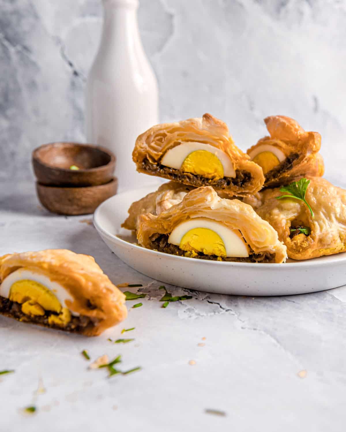 A stack of egg puffs on a dish.