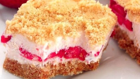 A strawberry shortcake bar with a bite taken out of it.