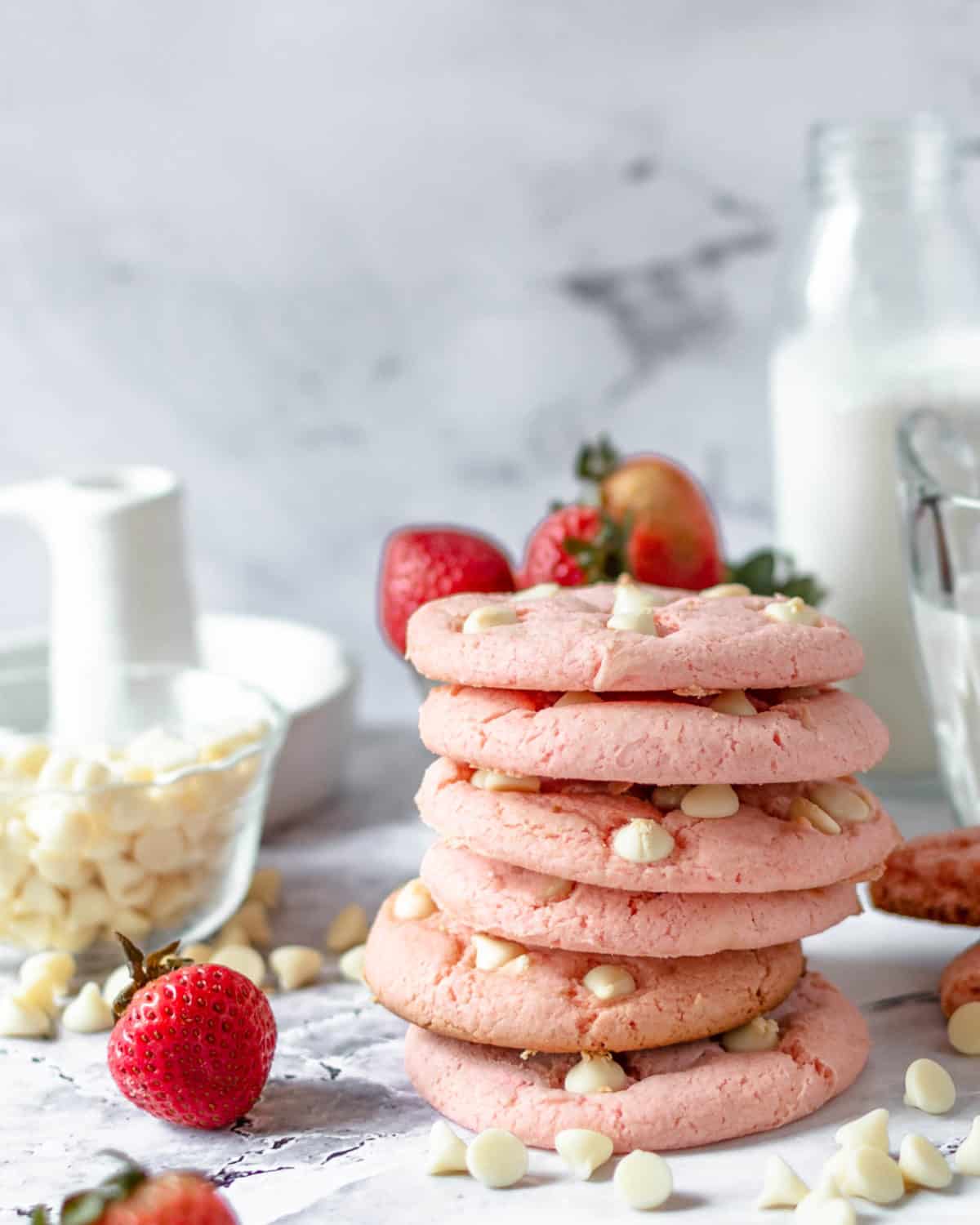 Six strawberry cookies stacked on top of each other.