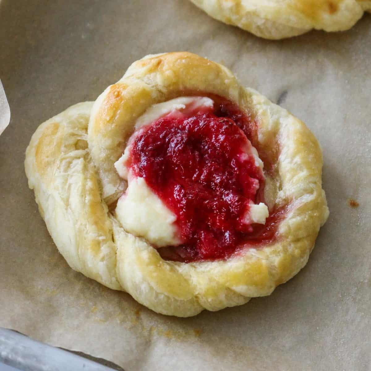 A close up of a strawberry Danish.