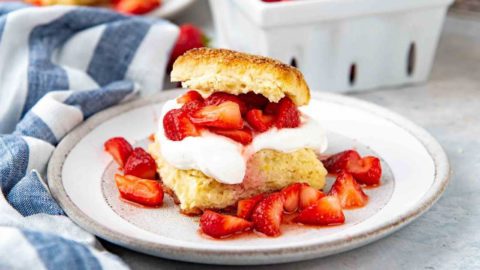 A slice of easy strawberry shortcake on a dish.