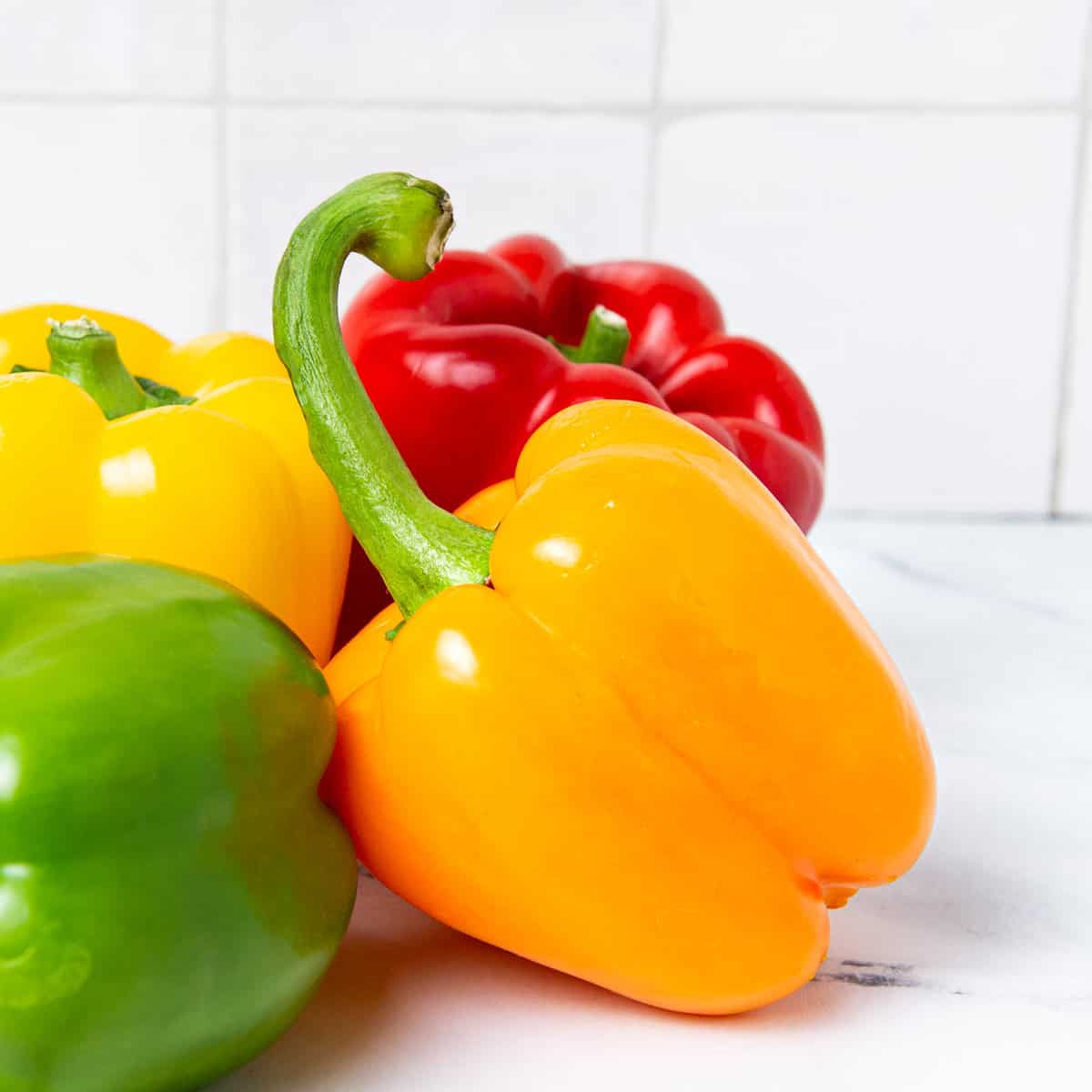 Bell peppers on a kitchen counter.