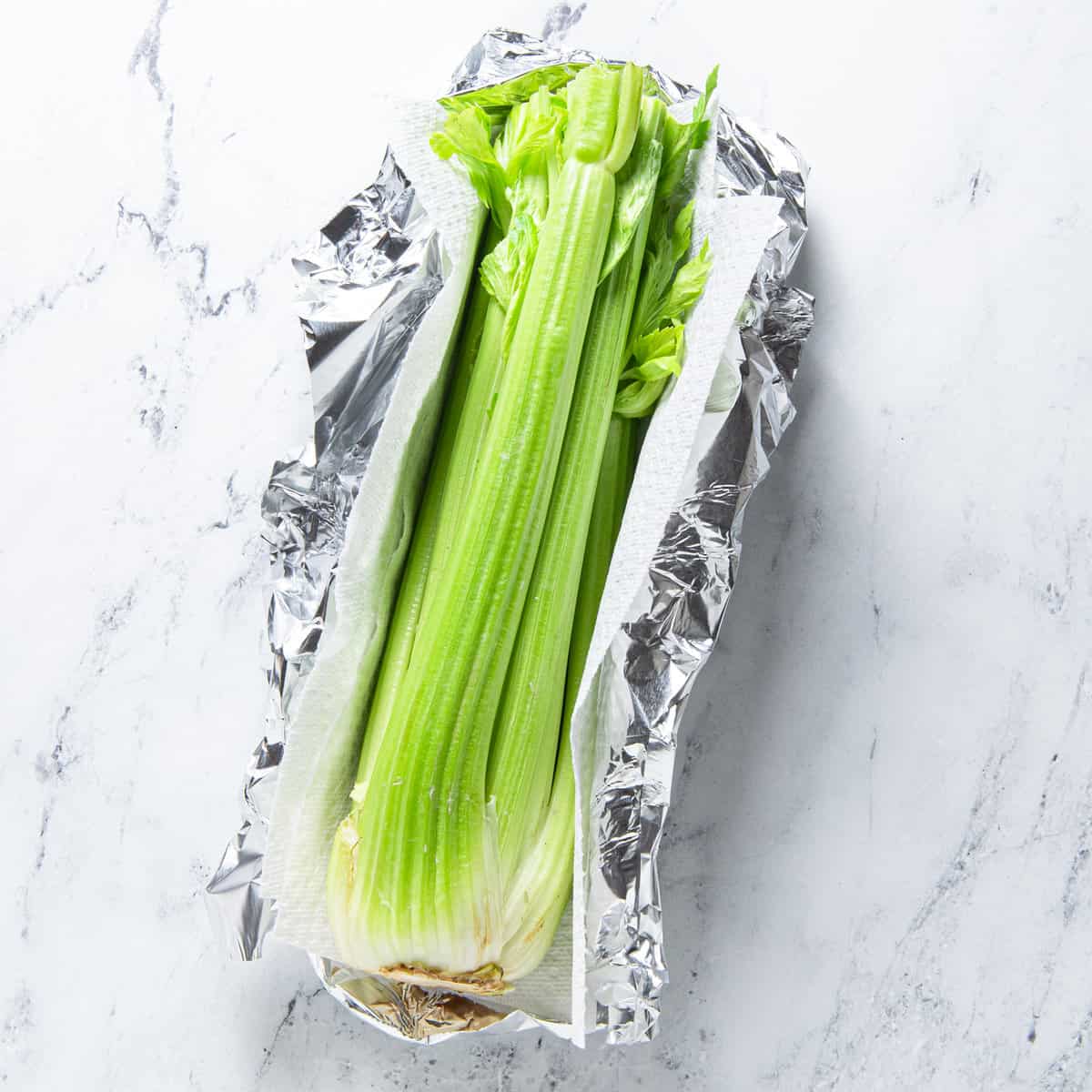 Celery wrapped in foil and a towel.