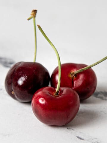 Cherries on a kitchen counter.