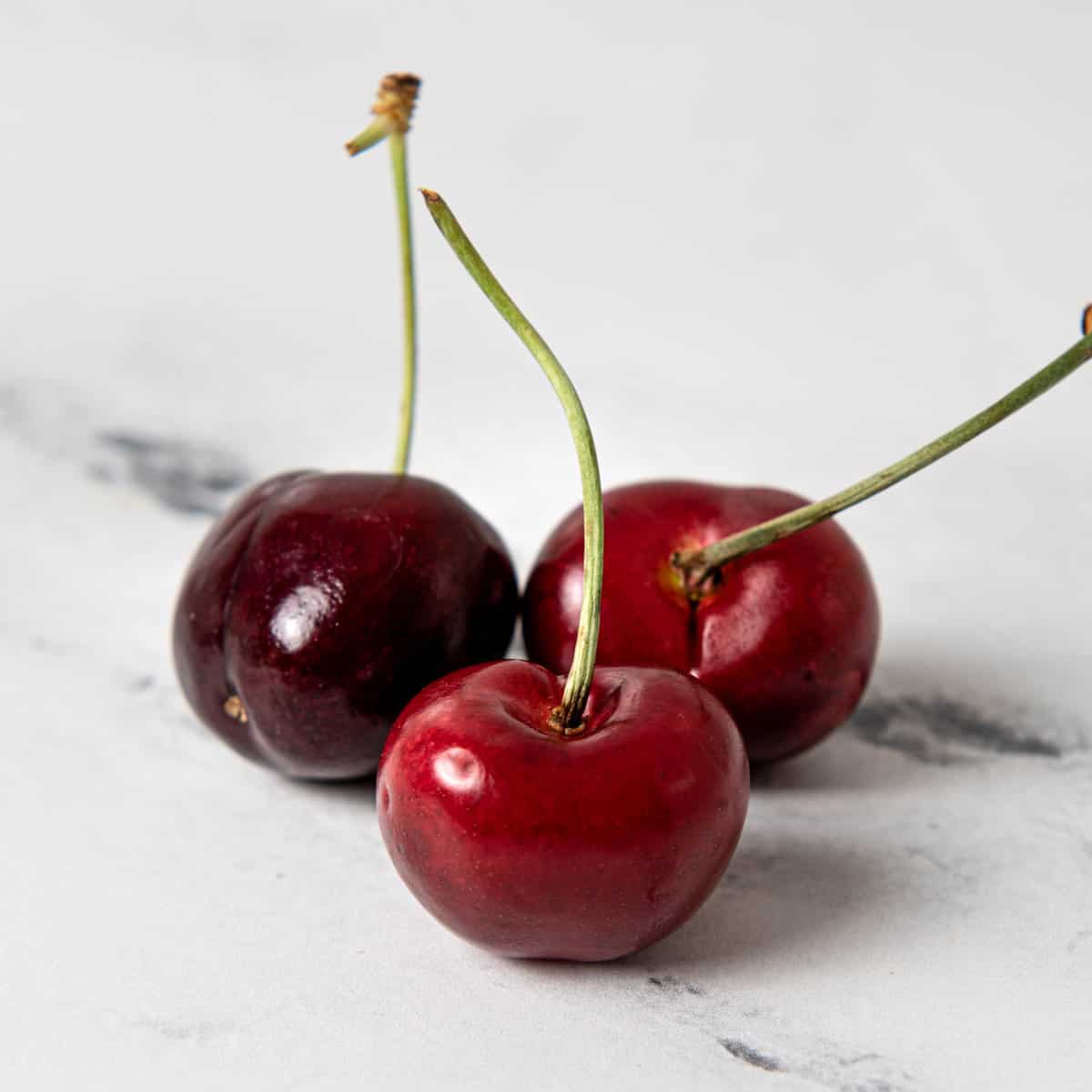 Cherries on a kitchen counter.