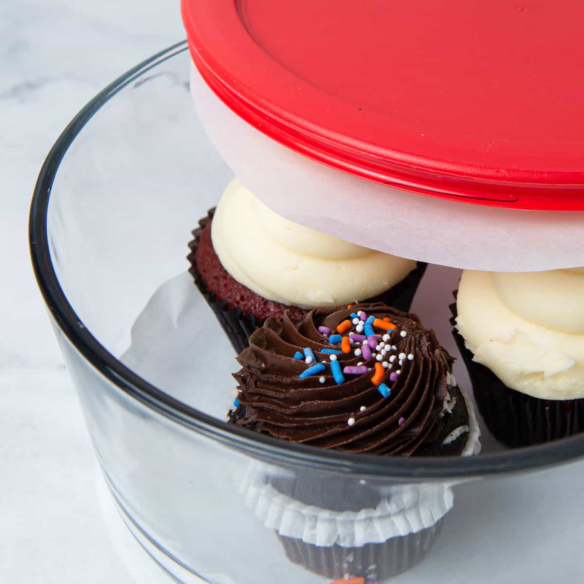 Cupcakes in a glass container.