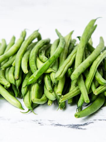 Green beans on a kitchen counter.