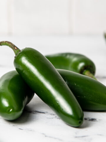 Jalapenos on a kitchen counter.