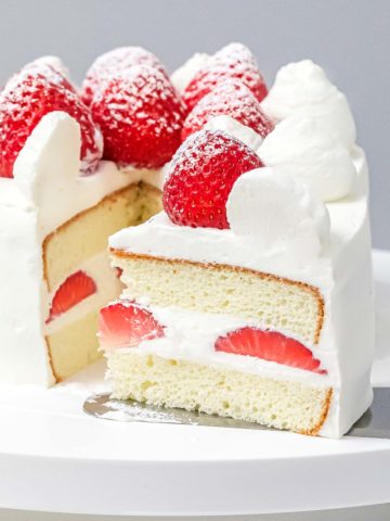 Japanese style strawberry shortcake on a cake stand.