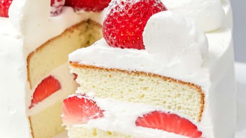 Japanese style strawberry shortcake on a cake stand.