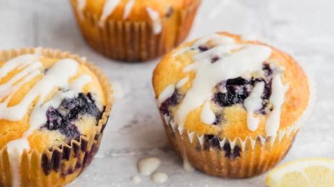 Close up of lemon blueberry muffins with lemon drizzle.