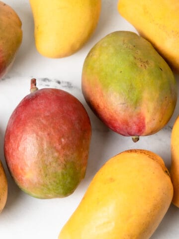 Mangoes on a kitchen counter.