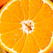 Close up image of a slice orange showing the segments.