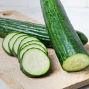 Sliced cucumbers on the cutting board.