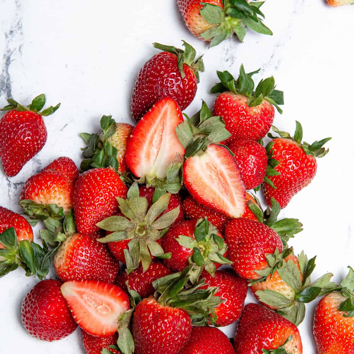 Overhead image of fresh strawberries on a counter top.