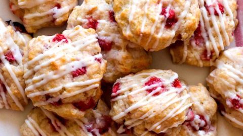 A pile of strawberry shortcake cookies on a plate.