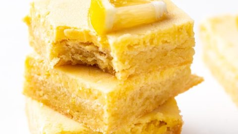 Three lemon bars stacked on each other.